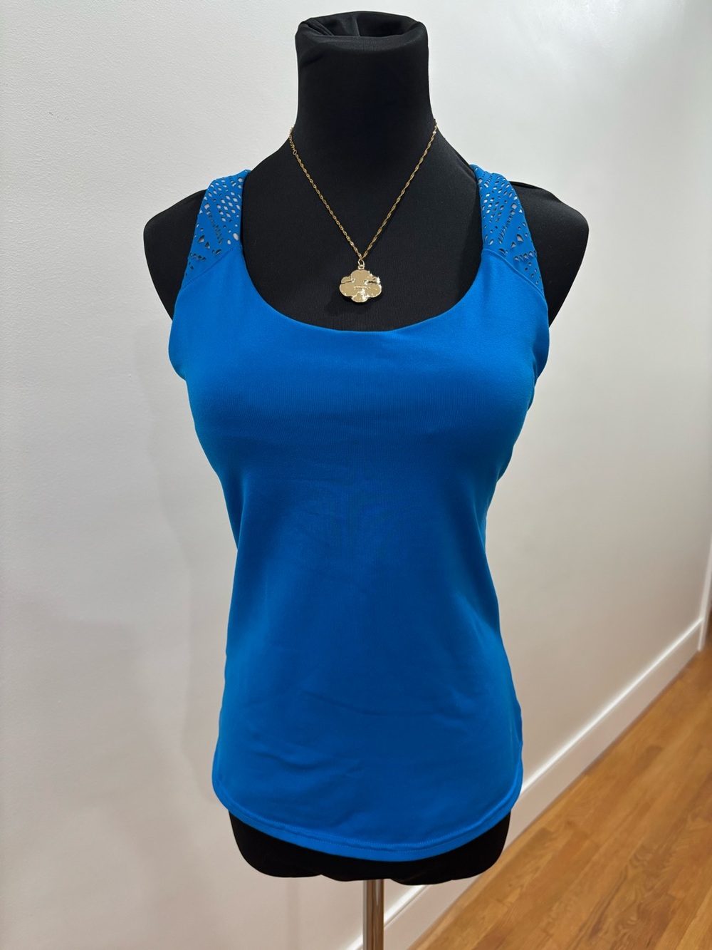 629. Alo Yoga Patina tank features unique laser-cut strap details